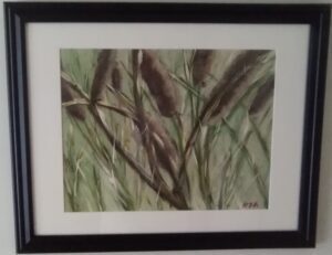 A painting of cattails in a black frame.