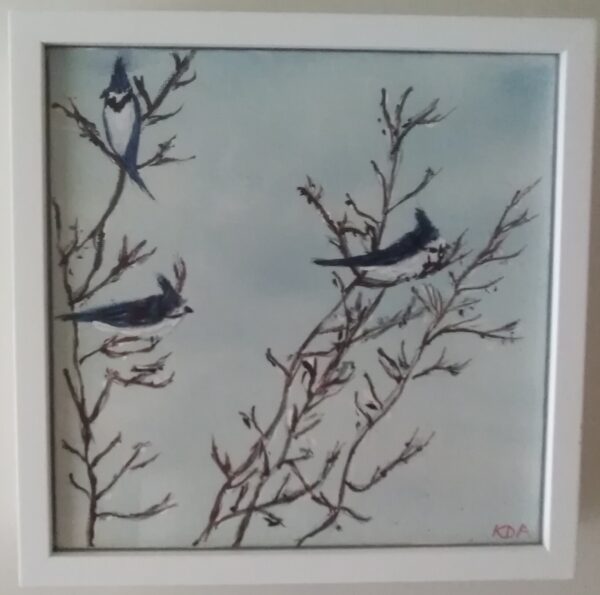 Three birds perched on a branch in a white frame.