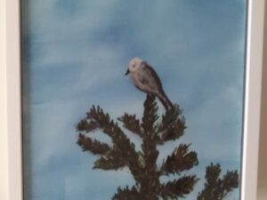 A painting of a bird perched on a pine tree.