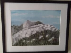 A painting of a mountain with snow on it.