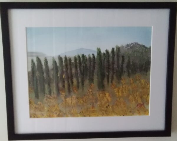 A painting of cypress trees on a wall.