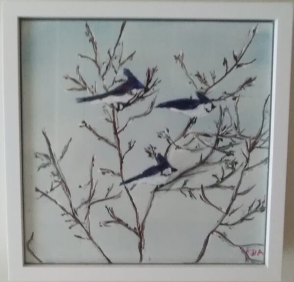 Three birds perched on a branch in a white frame.