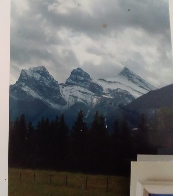 A photo of a mountain range with snow on it.