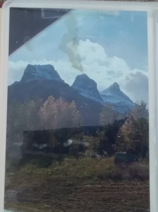 A photo of a mountain in a frame.