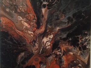 A painting in red and black theme and looks like an oil and water mix